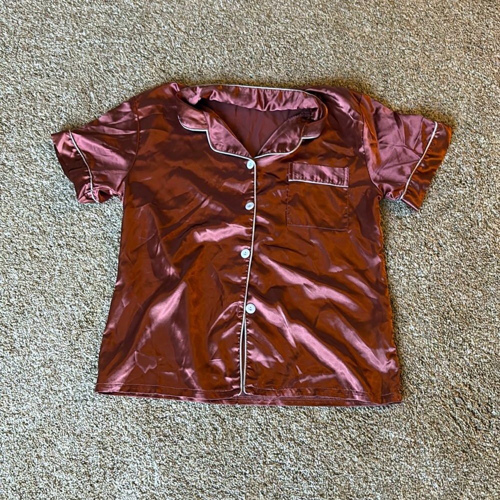 Sleep shirt, buttoned, silky soft to the touch.